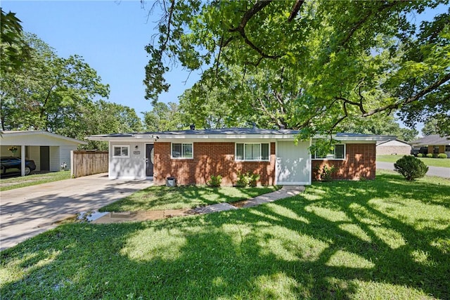 907 S Ithaca Ave, Russellville, AR 72801 - single story home with brick siding, a front lawn, and driveway