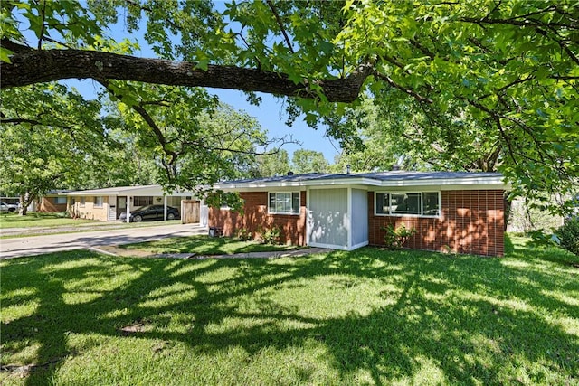 907 S Ithaca Ave, Russellville, AR 72801 - ranch-style home featuring brick siding, a front yard, and driveway