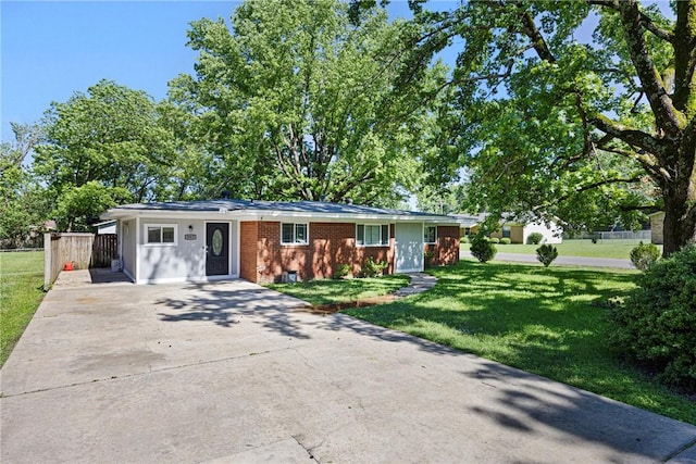 907 S Ithaca Ave, Russellville, AR 72801 - ranch-style home with driveway, a front lawn, and brick siding