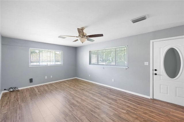 907 S Ithaca Ave, Russellville, AR 72801 - entryway featuring ceiling fan, wood finished floors, and baseboards