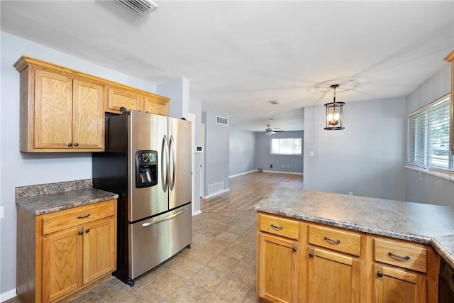 907 S Ithaca Ave, Russellville, AR 72801 - kitchen with stainless steel refrigerator with ice dispenser, a ceiling fan, open floor plan, decorative light fixtures, and baseboards