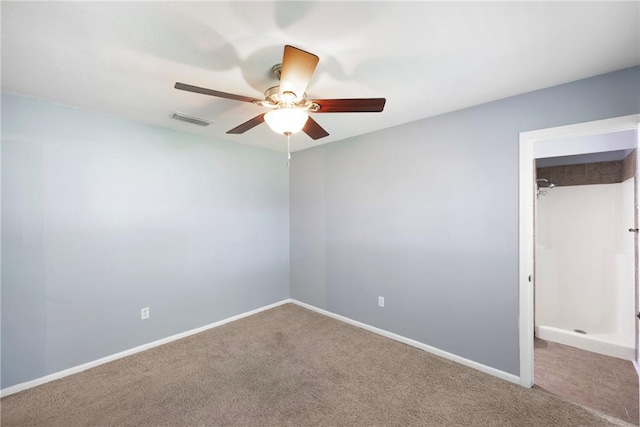 907 S Ithaca Ave, Russellville, AR 72801 - unfurnished bedroom with carpet flooring, a spacious closet, a closet, baseboards, and ceiling fan