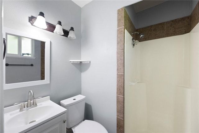 907 S Ithaca Ave, Russellville, AR 72801 - bathroom featuring walk in shower, toilet, and vanity