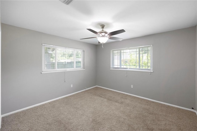 907 S Ithaca Ave, Russellville, AR 72801 - empty room featuring carpet, baseboards, and a ceiling fan