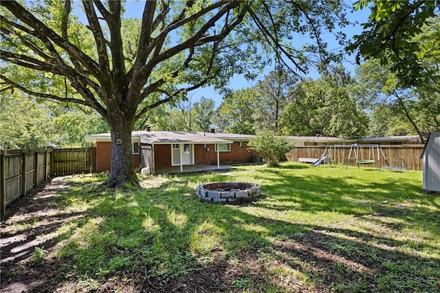 907 S Ithaca Ave, Russellville, AR 72801 - view of yard with a playground and an outdoor fire pit