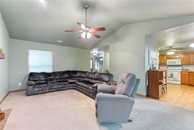 74 Twin Peak Dr, Holiday Island, AR 72631 - living area with a ceiling fan, light carpet, vaulted ceiling, and baseboards