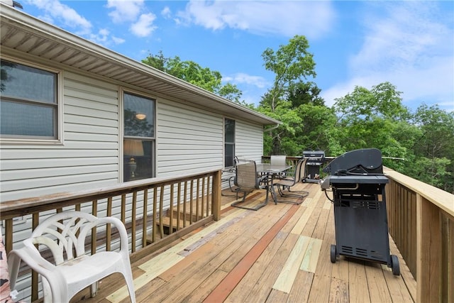 74 Twin Peak Dr, Holiday Island, AR 72631 - wooden deck with outdoor dining area and a grill