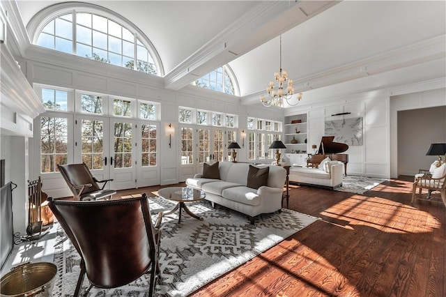 10760 Sugar Creek Rd, Bentonville, AR 72751 - living room featuring a chandelier, lofted ceiling, built in features, and wood finished floors