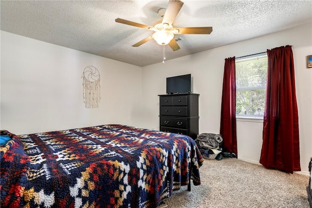 909 11th St, Bentonville, AR 72712 - bedroom featuring carpet, a textured ceiling, and a ceiling fan