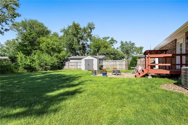 909 11th St, Bentonville, AR 72712 - view of yard with central AC and a deck