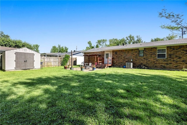 909 11th St, Bentonville, AR 72712 - back of house with cooling unit, a patio area, and brick siding