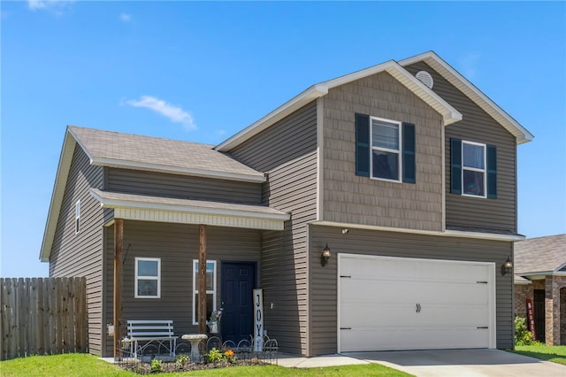 5003 W Claxton Cir, Fayetteville, AR 72704 - view of front of property with a garage, concrete driveway, and a porch