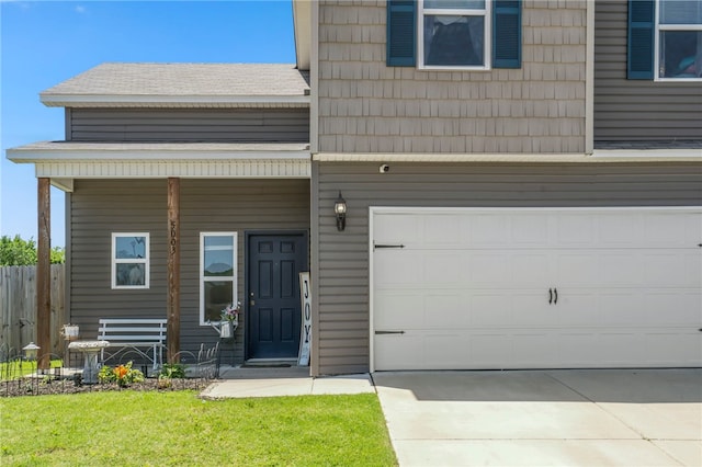 5003 W Claxton Cir, Fayetteville, AR 72704 - view of front facade with concrete driveway and a porch