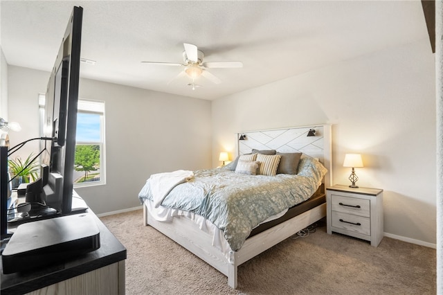 5003 W Claxton Cir, Fayetteville, AR 72704 - bedroom with light colored carpet, baseboards, and a ceiling fan