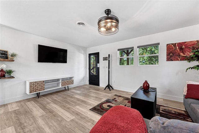 312 NW J St, Bentonville, AR 72712 - living area featuring wood finished floors and baseboards