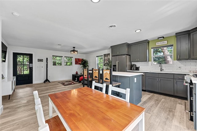 312 NW J St, Bentonville, AR 72712 - dining space featuring light wood-style flooring, baseboards, and recessed lighting