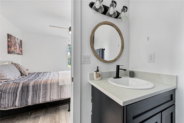 312 NW J St, Bentonville, AR 72712 - ensuite bathroom with vanity and wood finished floors