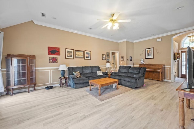 2977 Quartz Dr, Fayetteville, AR 72704 - living room featuring a ceiling fan, light wood-type flooring, wainscoting, arched walkways, and ornamental molding