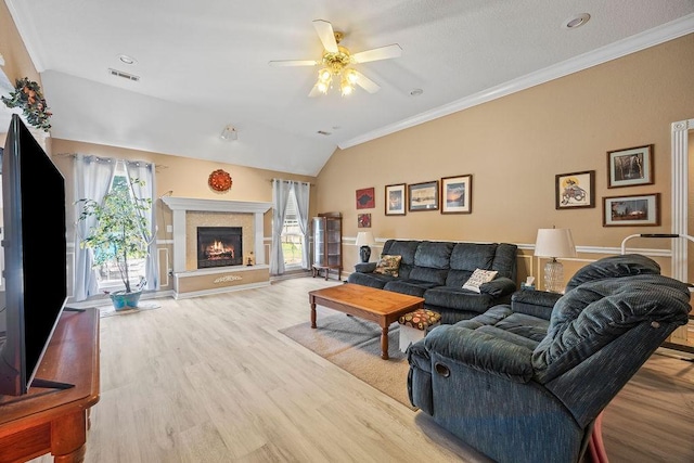 2977 Quartz Dr, Fayetteville, AR 72704 - living room with a ceiling fan, lofted ceiling, wood finished floors, a lit fireplace, and ornamental molding