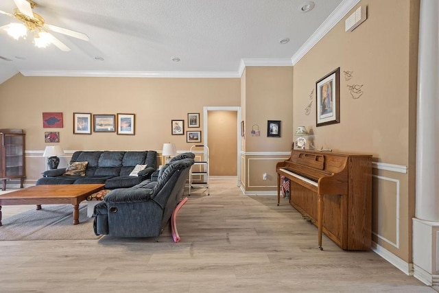 2977 Quartz Dr, Fayetteville, AR 72704 - living room with ceiling fan, light wood-style flooring, ornamental molding, and a wainscoted wall