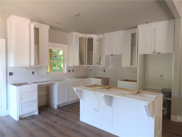 6 Marionet Cir, Bella Vista, AR 72714 - kitchen featuring a kitchen island, dark wood-type flooring, and white cabinets