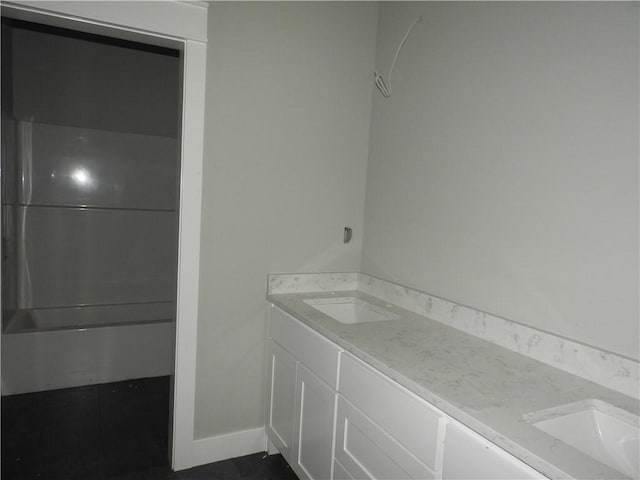 6 Marionet Cir, Bella Vista, AR 72714 - full bathroom featuring double vanity and baseboards