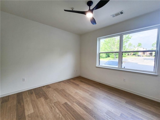 1115 N Leverett Ave Unit 102, Fayetteville, AR 72703 - spare room featuring a ceiling fan, wood finished floors, and baseboards