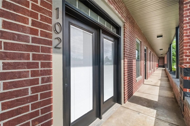 1115 N Leverett Ave Unit 102, Fayetteville, AR 72703 - doorway to property with brick siding