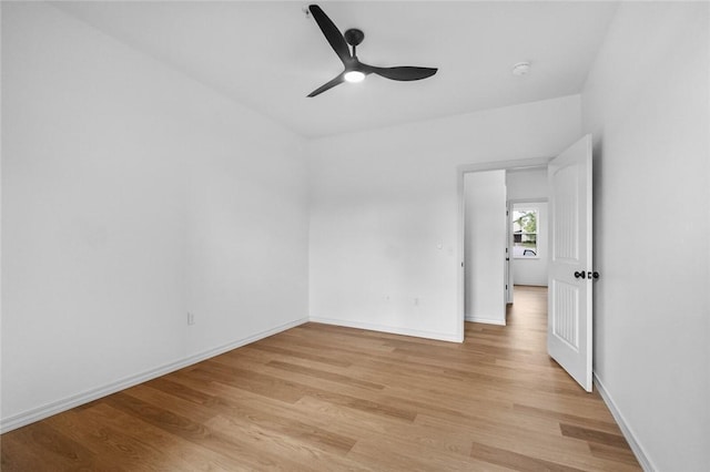 1115 N Leverett Ave Unit 102, Fayetteville, AR 72703 - spare room featuring light wood-style flooring, ceiling fan, and baseboards