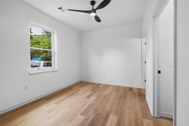 1115 N Leverett Ave Unit 102, Fayetteville, AR 72703 - unfurnished bedroom featuring light wood-style flooring, baseboards, and ceiling fan