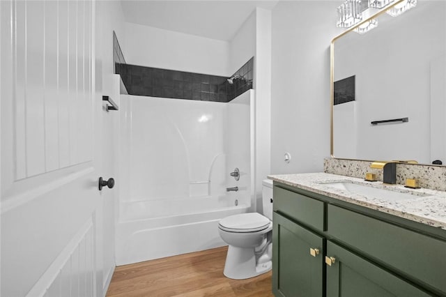 1115 N Leverett Ave Unit 102, Fayetteville, AR 72703 - full bath featuring vanity, wood finished floors, washtub / shower combination, and toilet