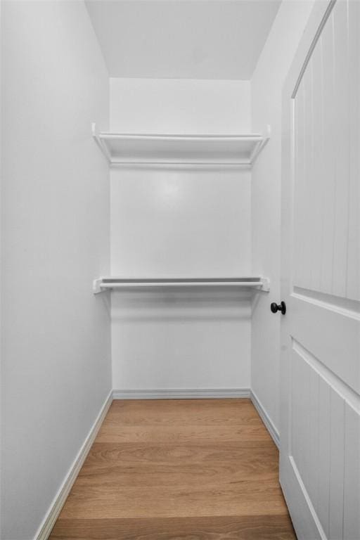 1115 N Leverett Ave Unit 102, Fayetteville, AR 72703 - walk in closet with wood finished floors