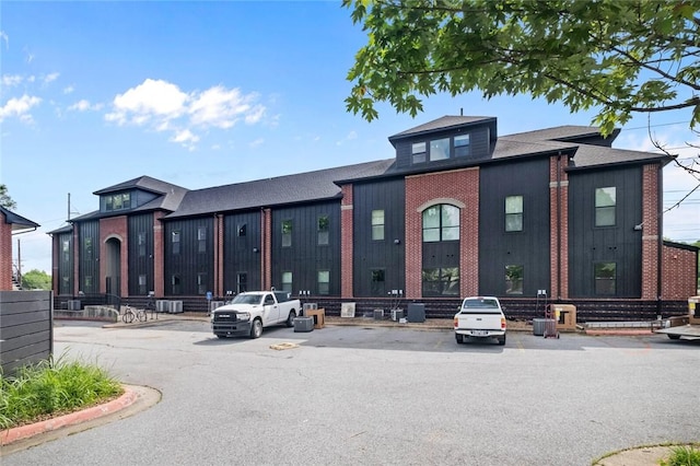 1115 N Leverett Ave Unit 102, Fayetteville, AR 72703 - view of building exterior featuring uncovered parking