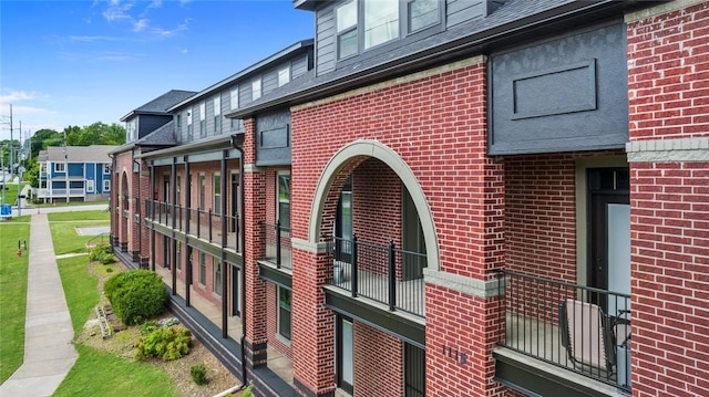 1115 N Leverett Ave Unit 102, Fayetteville, AR 72703 - view of property exterior featuring brick siding