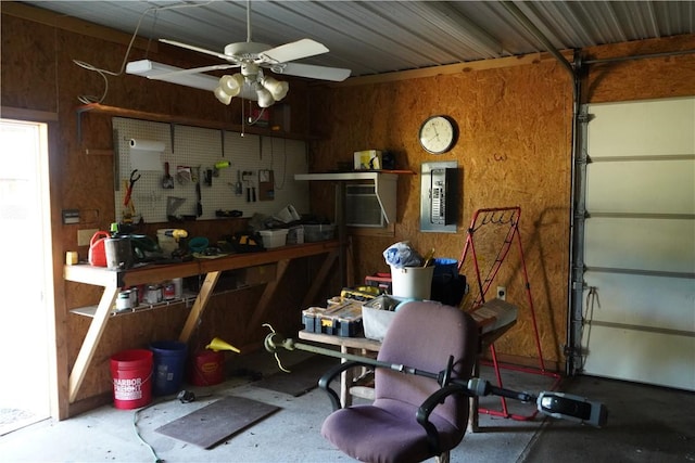 2655 S Elmira Ave, Russellville, AR 72802 - garage with a workshop area, a ceiling fan, wood walls, and electric panel