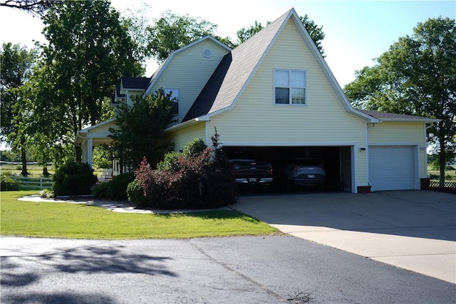 2655 S Elmira Ave, Russellville, AR 72802 - view of property exterior with driveway, a yard, a shingled roof, and a garage