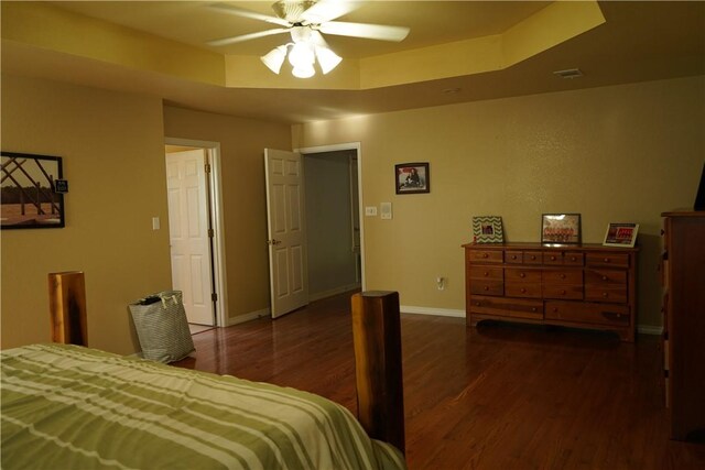 2655 S Elmira Ave, Russellville, AR 72802 - bedroom with wood finished floors, a raised ceiling, baseboards, and ceiling fan