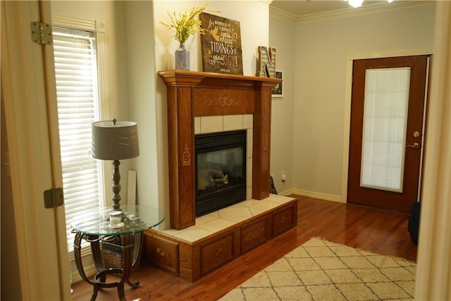2655 S Elmira Ave, Russellville, AR 72802 - living room with wood finished floors, crown molding, a tile fireplace, and baseboards