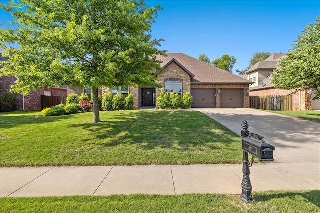 1651 Quail Ridge Way, Bentonville, AR 72713 - view of front facade with concrete driveway, an attached garage, brick siding, and stone siding