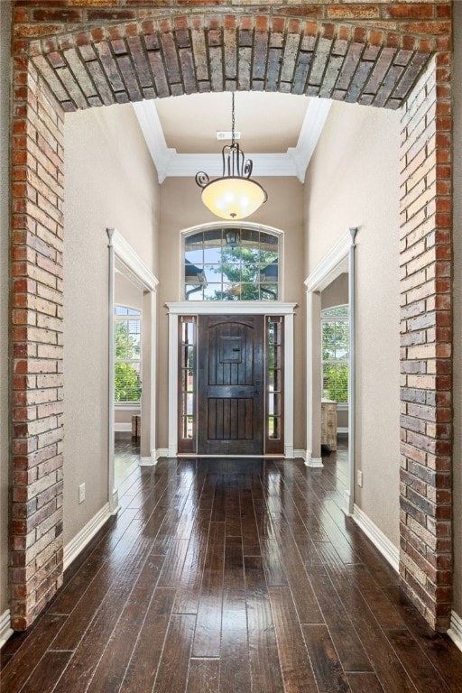 1651 Quail Ridge Way, Bentonville, AR 72713 - foyer entrance featuring ornamental molding, hardwood / wood-style flooring, baseboards, a chandelier, and a towering ceiling
