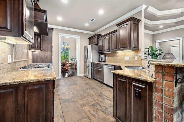1651 Quail Ridge Way, Bentonville, AR 72713 - kitchen featuring a sink, appliances with stainless steel finishes, dark brown cabinets, light stone countertops, and recessed lighting