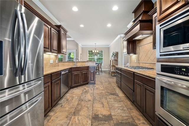 1651 Quail Ridge Way, Bentonville, AR 72713 - kitchen featuring appliances with stainless steel finishes, ornamental molding, a sink, a chandelier, and recessed lighting
