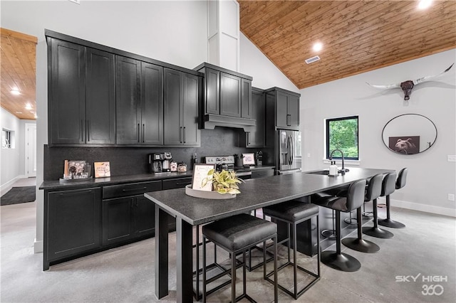 8775 Falls Hollow Rd, Rogers, AR 72756 - kitchen with wood ceiling, a sink, dark cabinets, appliances with stainless steel finishes, and dark countertops