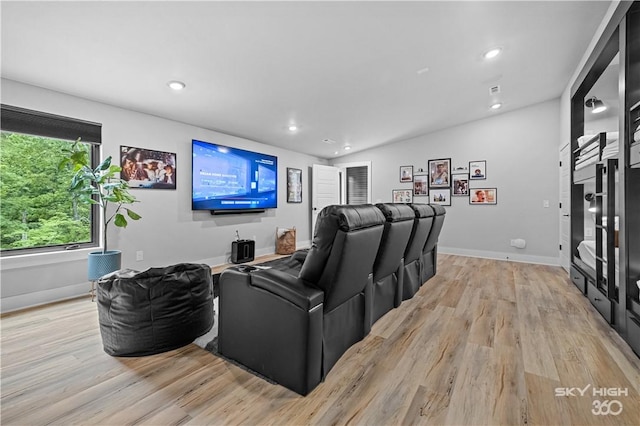 8775 Falls Hollow Rd, Rogers, AR 72756 - home theater room with light wood finished floors, recessed lighting, baseboards, and lofted ceiling