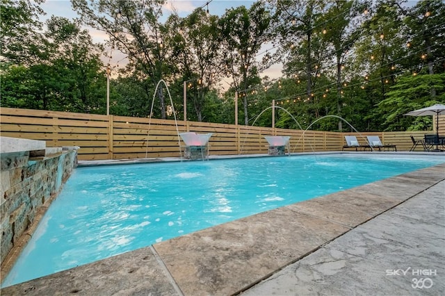 8775 Falls Hollow Rd, Rogers, AR 72756 - view of swimming pool featuring view of scattered trees and a patio