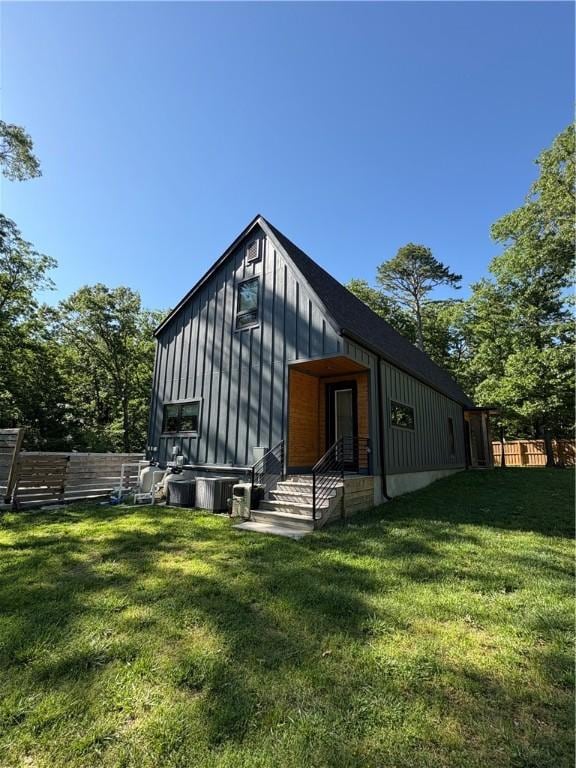 8775 Falls Hollow Rd, Rogers, AR 72756 - rear view of property featuring board and batten siding
