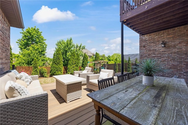 13 Dawn Hills Dr, Bentonville, AR 72712 - wooden deck with an outdoor living space, outdoor dining space, and a fenced backyard