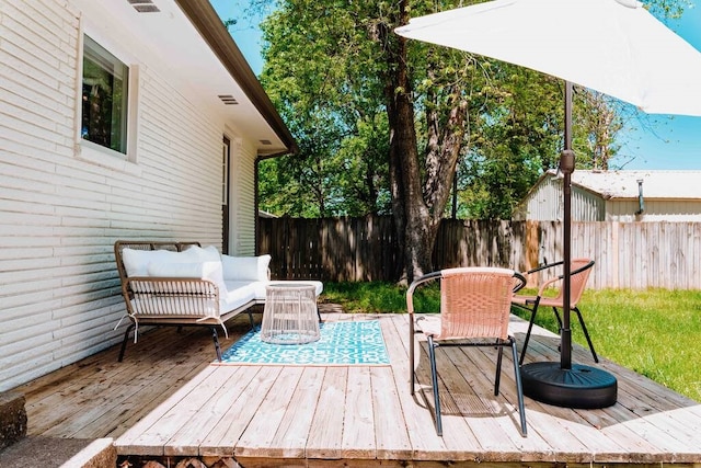 208 NW L St, Bentonville, AR 72712 - wooden terrace featuring a fenced backyard and an outdoor living space