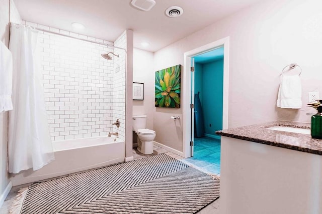 208 NW L St, Bentonville, AR 72712 - full bathroom featuring toilet, shower / bath combo with shower curtain, vanity, and baseboards