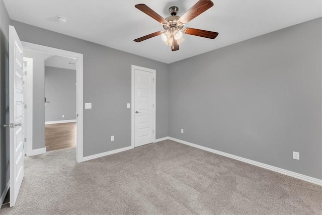 7326 Drury Ave, Springdale, AR 72762 - unfurnished bedroom featuring carpet floors, baseboards, and ceiling fan